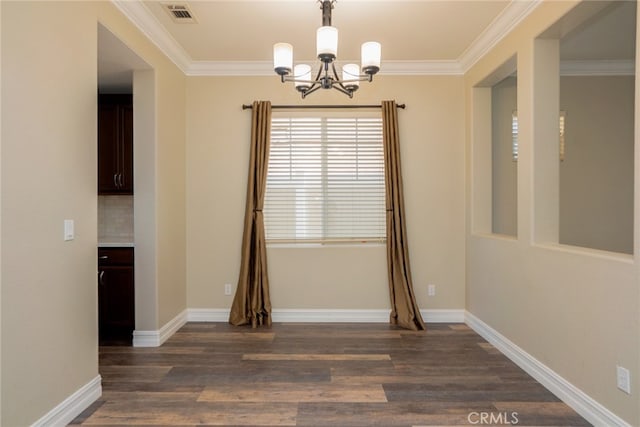 12241 Amaryllis, Yucaipa, CA 92399 - unfurnished room featuring a chandelier, ornamental molding, dark wood finished floors, and baseboards