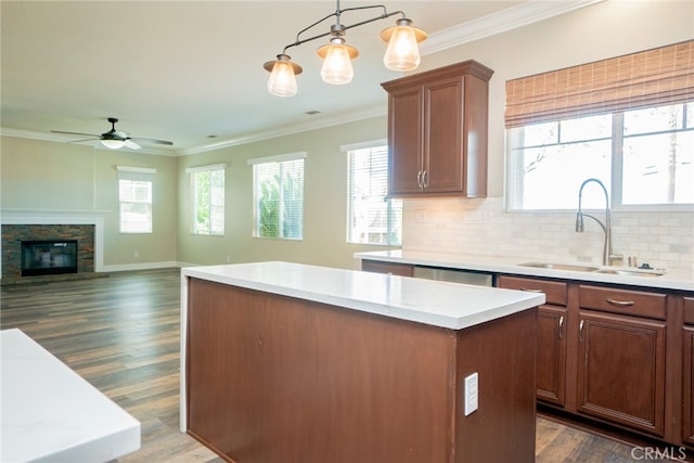 12241 Amaryllis, Yucaipa, CA 92399 - kitchen with a sink, a kitchen island, dark wood-type flooring, ceiling fan, and light countertops
