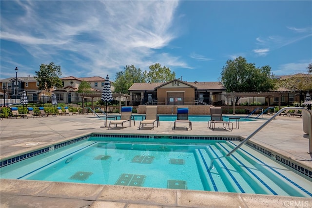 12241 Amaryllis, Yucaipa, CA 92399 - community pool with a pergola, a residential view, a patio area, and shuffleboard