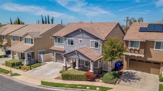 12241 Amaryllis, Yucaipa, CA 92399 - view of front of home with concrete driveway, an attached garage, a tile roof, stucco siding, and a residential view