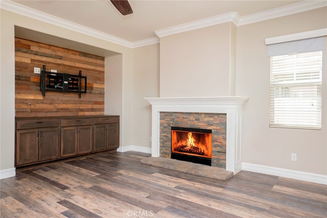 12241 Amaryllis, Yucaipa, CA 92399 - unfurnished living room featuring dark wood-style flooring, crown molding, a stone fireplace, baseboards, and ceiling fan