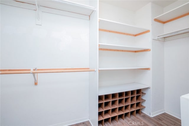 12241 Amaryllis, Yucaipa, CA 92399 - spacious closet featuring wood finished floors