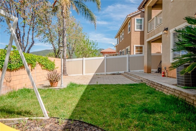 12241 Amaryllis, Yucaipa, CA 92399 - view of yard featuring a patio area, central AC, and a mountain view