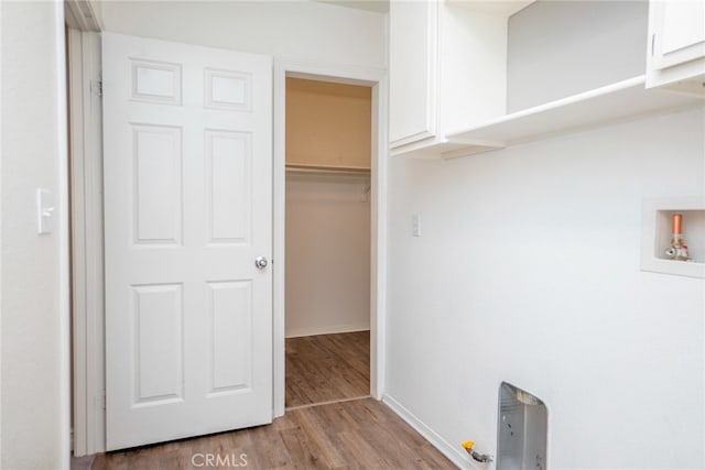 12241 Amaryllis, Yucaipa, CA 92399 - laundry area with wood finished floors, cabinet space, washer hookup, and baseboards