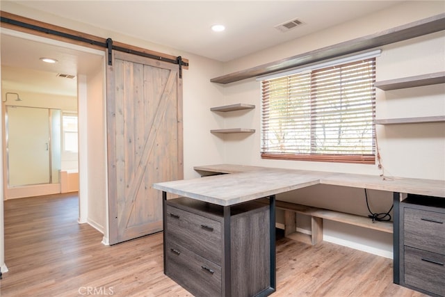 12241 Amaryllis, Yucaipa, CA 92399 - unfurnished office with a barn door, light wood-style floors, healthy amount of natural light, and recessed lighting