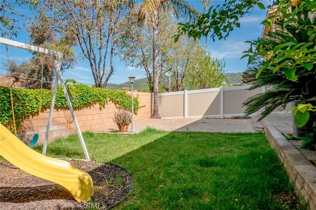 12241 Amaryllis, Yucaipa, CA 92399 - view of yard with a playground and a patio