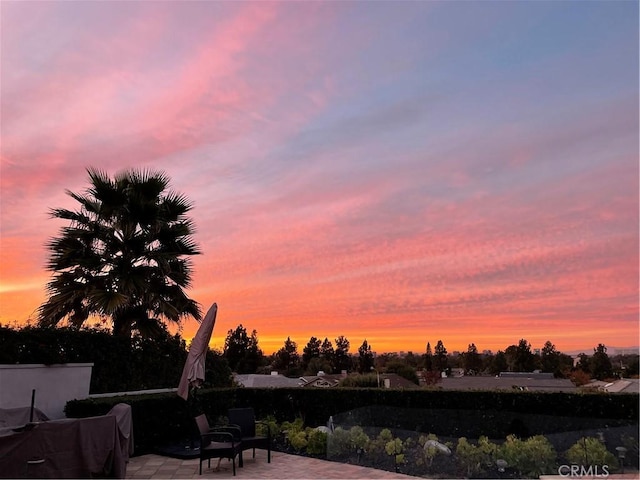 view of patio terrace at dusk