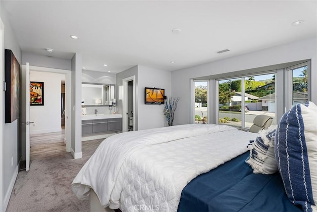 bedroom with carpet floors, baseboards, recessed lighting, access to outside, and ensuite bathroom
