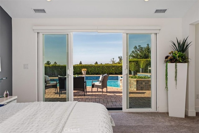 bedroom featuring access to exterior, carpet floors, multiple windows, and recessed lighting