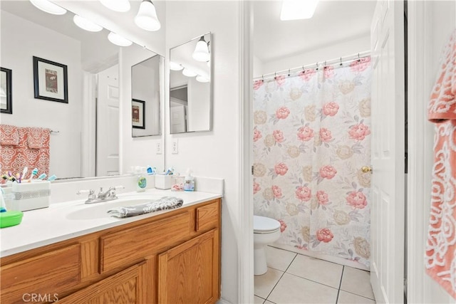 full bath featuring a shower with shower curtain, toilet, tile patterned flooring, and vanity