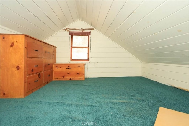 additional living space with wood ceiling, carpet, wooden walls, and vaulted ceiling