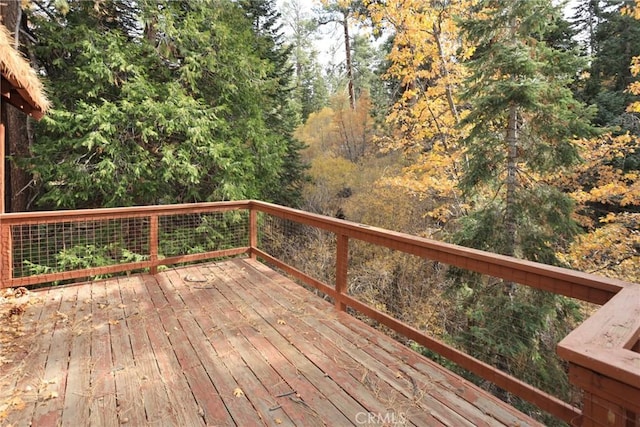 deck featuring a view of trees