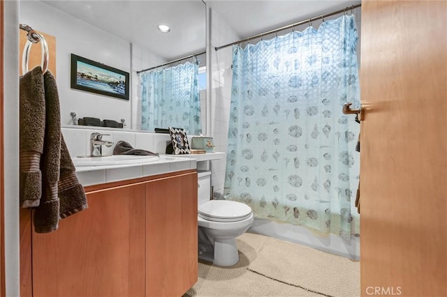 16745 Bayview Dr Unit B, Sunset Beach, CA 90742 - bathroom with shower / bath combination with curtain, toilet, and vanity
