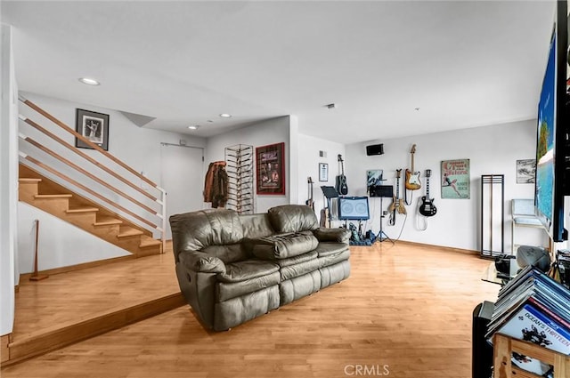 16745 Bayview Dr Unit B, Sunset Beach, CA 90742 - living area with wood finished floors, stairway, recessed lighting, and baseboards