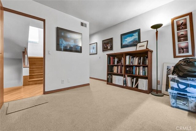 16745 Bayview Dr Unit B, Sunset Beach, CA 90742 - interior space featuring carpet flooring, stairs, and baseboards