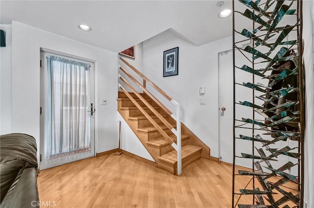 16745 Bayview Dr Unit B, Sunset Beach, CA 90742 - stairway with wood finished floors, baseboards, and recessed lighting