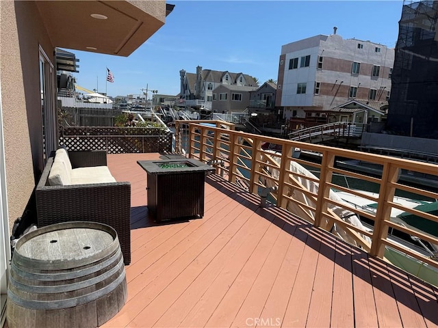 16745 Bayview Dr Unit B, Sunset Beach, CA 90742 - deck with an outdoor fire pit