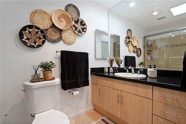 full bathroom featuring tile patterned floors, toilet, visible vents, a shower stall, and vanity