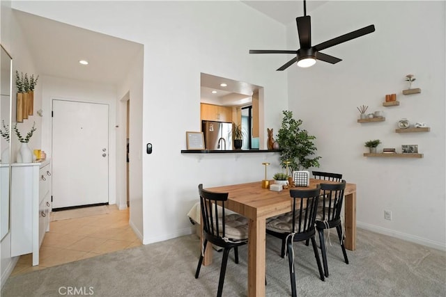 dining room featuring recessed lighting, a ceiling fan, baseboards, and light carpet