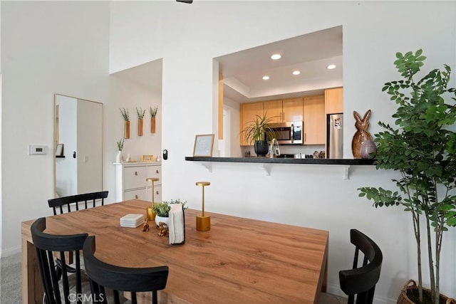 dining area featuring recessed lighting
