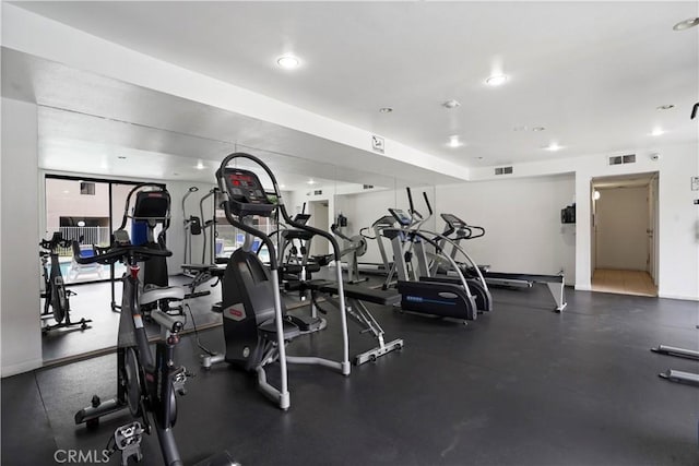 exercise room with visible vents and recessed lighting