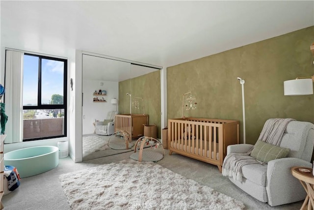 bedroom with carpet floors and a closet