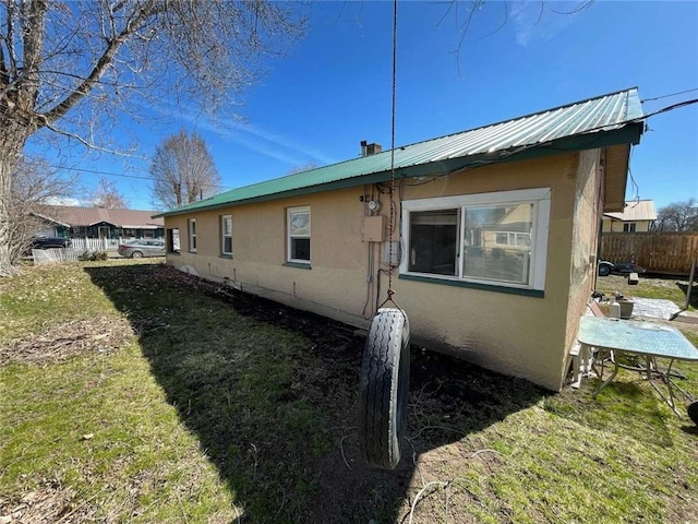 107 N Rine St, Alturas, CA 96101 - view of side of home featuring metal roof and stucco siding