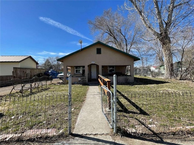 107 N Rine St, Alturas, CA 96101 - bungalow-style home with stucco siding and a fenced front yard