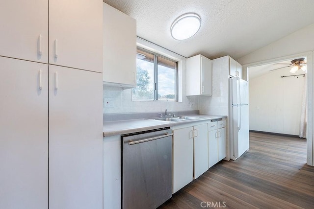 27062 Rd 400, Madera, CA 93636 - kitchen featuring white cabinetry, light countertops, stainless steel dishwasher, a sink, and freestanding refrigerator