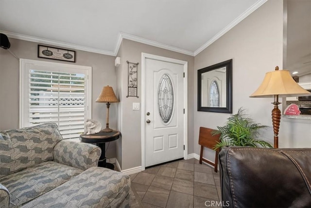 tiled foyer entrance with baseboards and crown molding