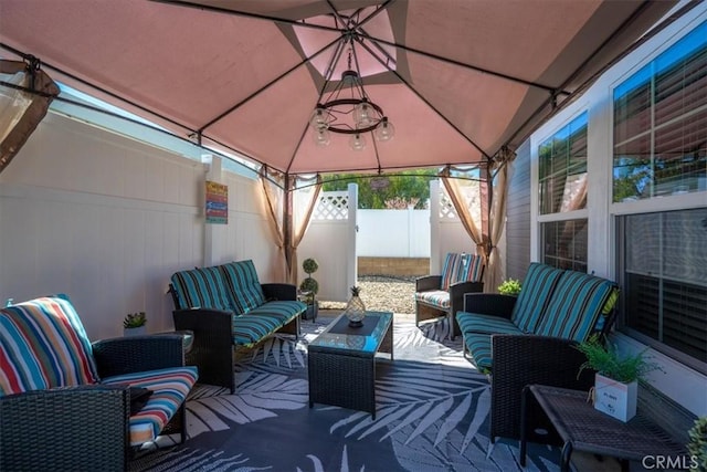 view of patio / terrace with an outdoor hangout area and fence