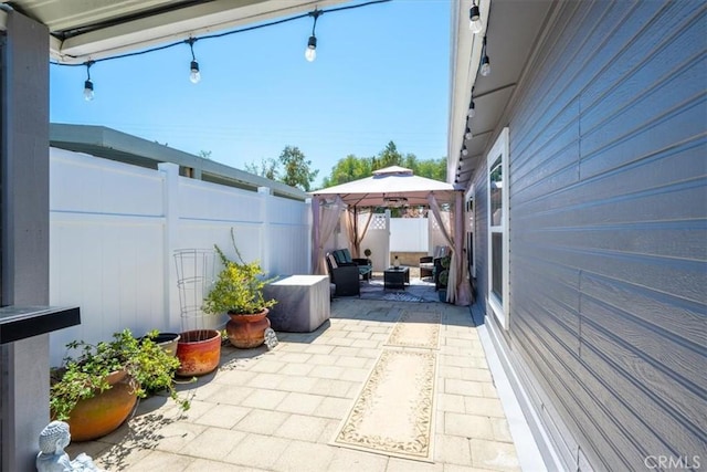 view of patio / terrace with a gazebo and fence