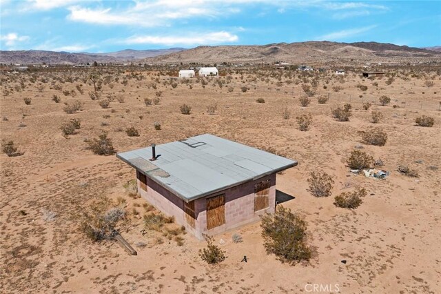 exterior space featuring a mountain view and view of desert