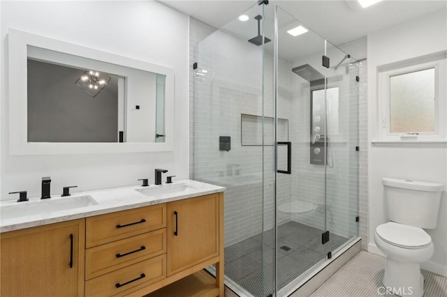 23010 Finch St, Grand Terrace, CA 92313 - bathroom with a shower stall, double vanity, and tile patterned flooring