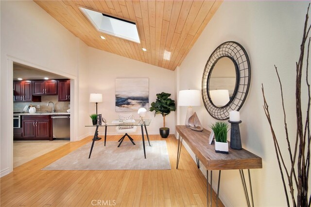 33571 Binnacle Dr, Dana Point, CA 92629 - office space featuring vaulted ceiling, a skylight, light wood finished floors, recessed lighting, and wooden ceiling