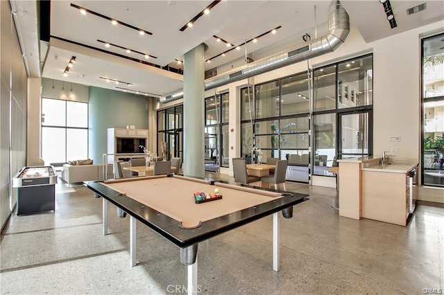 133 The Promenade N Unit 317, Long Beach, CA 90802 - game room featuring speckle patterned floor, billiards table, plenty of natural light, a towering ceiling, and a sink
