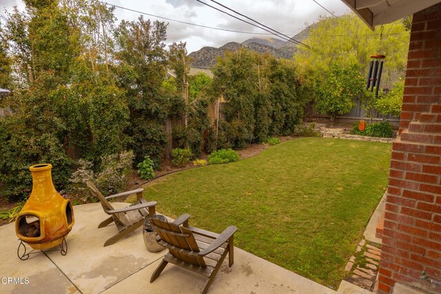 1009 Grandview Ave, Ojai, CA 93023 - fenced backyard with a patio area and a mountain view
