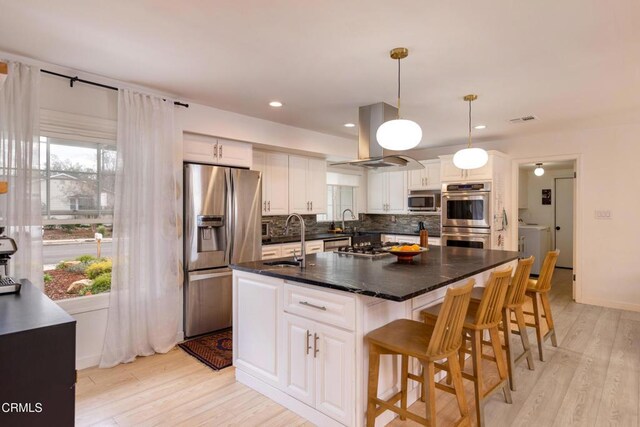 1009 Grandview Ave, Ojai, CA 93023 - kitchen with appliances with stainless steel finishes, plenty of natural light, tasteful backsplash, white cabinetry, and recessed lighting