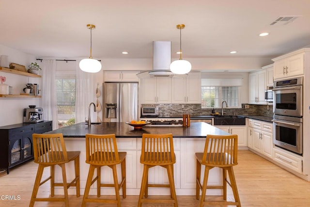1009 Grandview Ave, Ojai, CA 93023 - kitchen featuring stainless steel appliances, plenty of natural light, dark countertops, tasteful backsplash, and recessed lighting