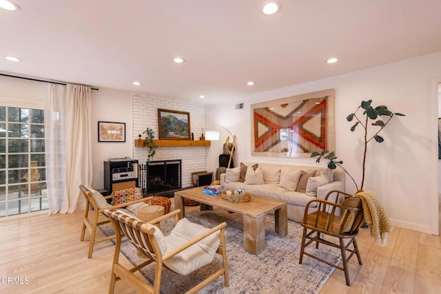 1009 Grandview Ave, Ojai, CA 93023 - living area featuring light wood finished floors, a brick fireplace, and recessed lighting