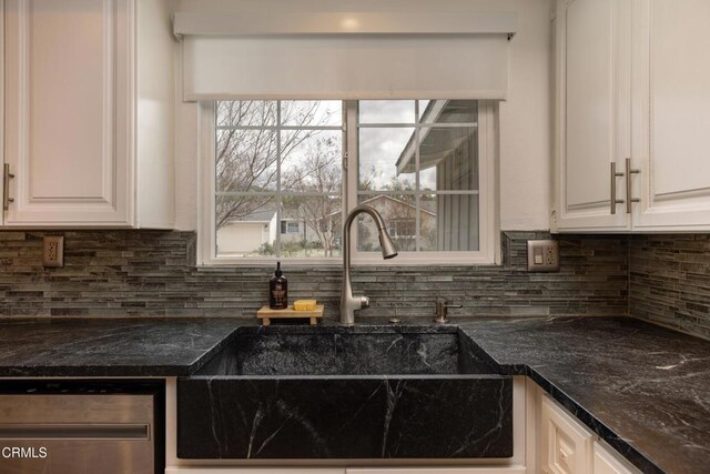 1009 Grandview Ave, Ojai, CA 93023 - kitchen with stainless steel dishwasher, white cabinets, and decorative backsplash