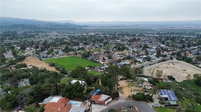 drone / aerial view featuring a mountain view and a residential view