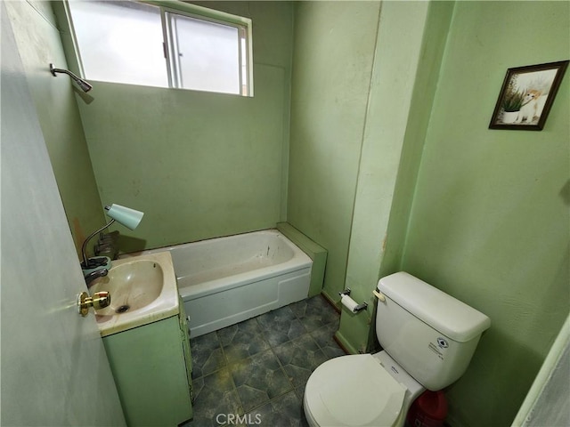 full bathroom featuring toilet, vanity, and a tub to relax in