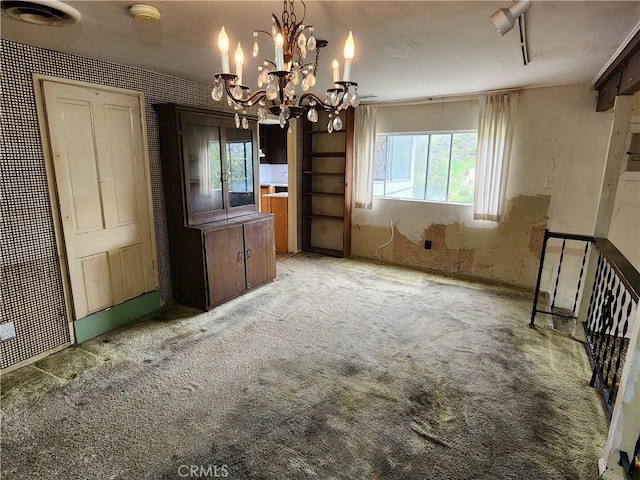 unfurnished dining area featuring light carpet, visible vents, and plenty of natural light
