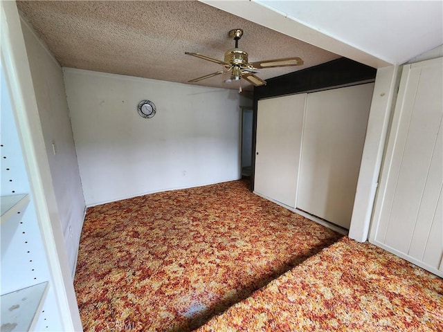 unfurnished bedroom with a closet, ceiling fan, and carpet floors
