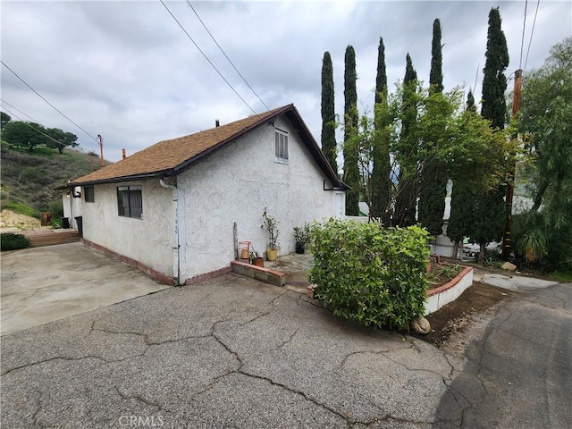 view of property exterior featuring a patio area and stucco siding
