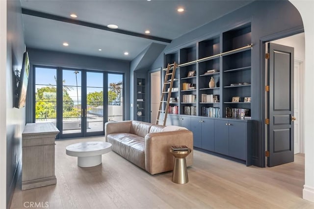 living area featuring recessed lighting, light wood-style flooring, and french doors