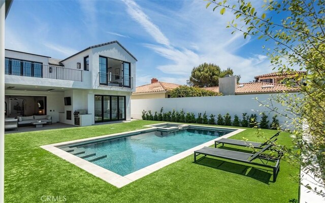 view of swimming pool featuring a lawn, an outdoor living space, a patio area, and a fenced backyard