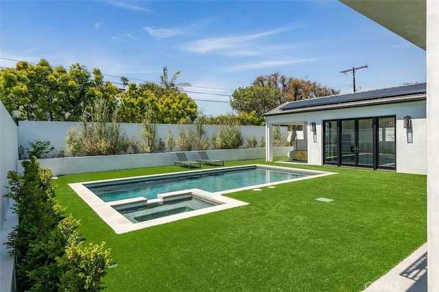 view of pool featuring a fenced in pool, a lawn, a fenced backyard, and an in ground hot tub