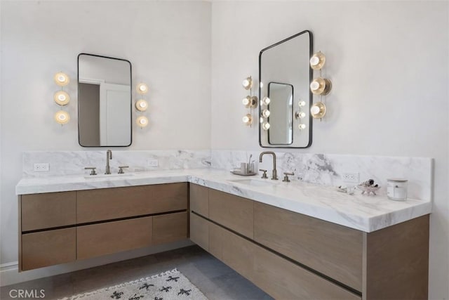 bathroom featuring a sink and double vanity